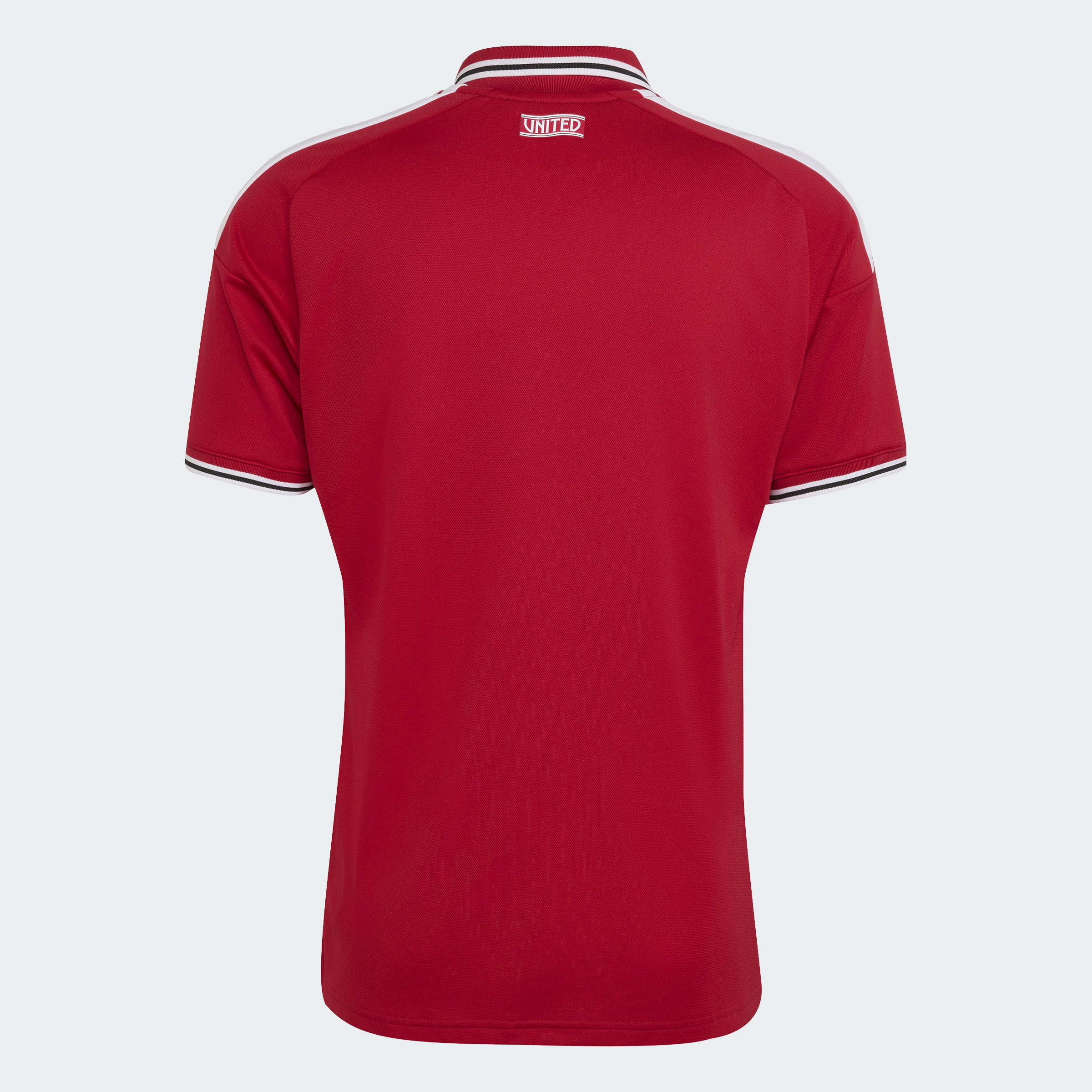 manchester united 2026/27 home shirt cropped, red and white, back view on background