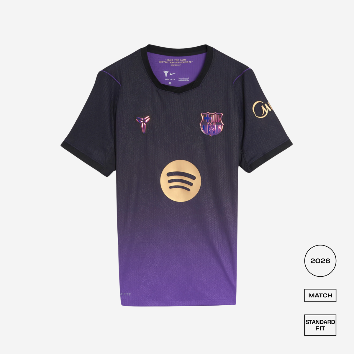 A short-sleeve soccer jersey displayed flat against a light gray background. The jersey features a dark navy-to-purple gradient, with the FC Barcelona crest on the left chest, a pinkish-purple Puskékó-style crest on the right chest, and a gold Spotify logo on the center front.