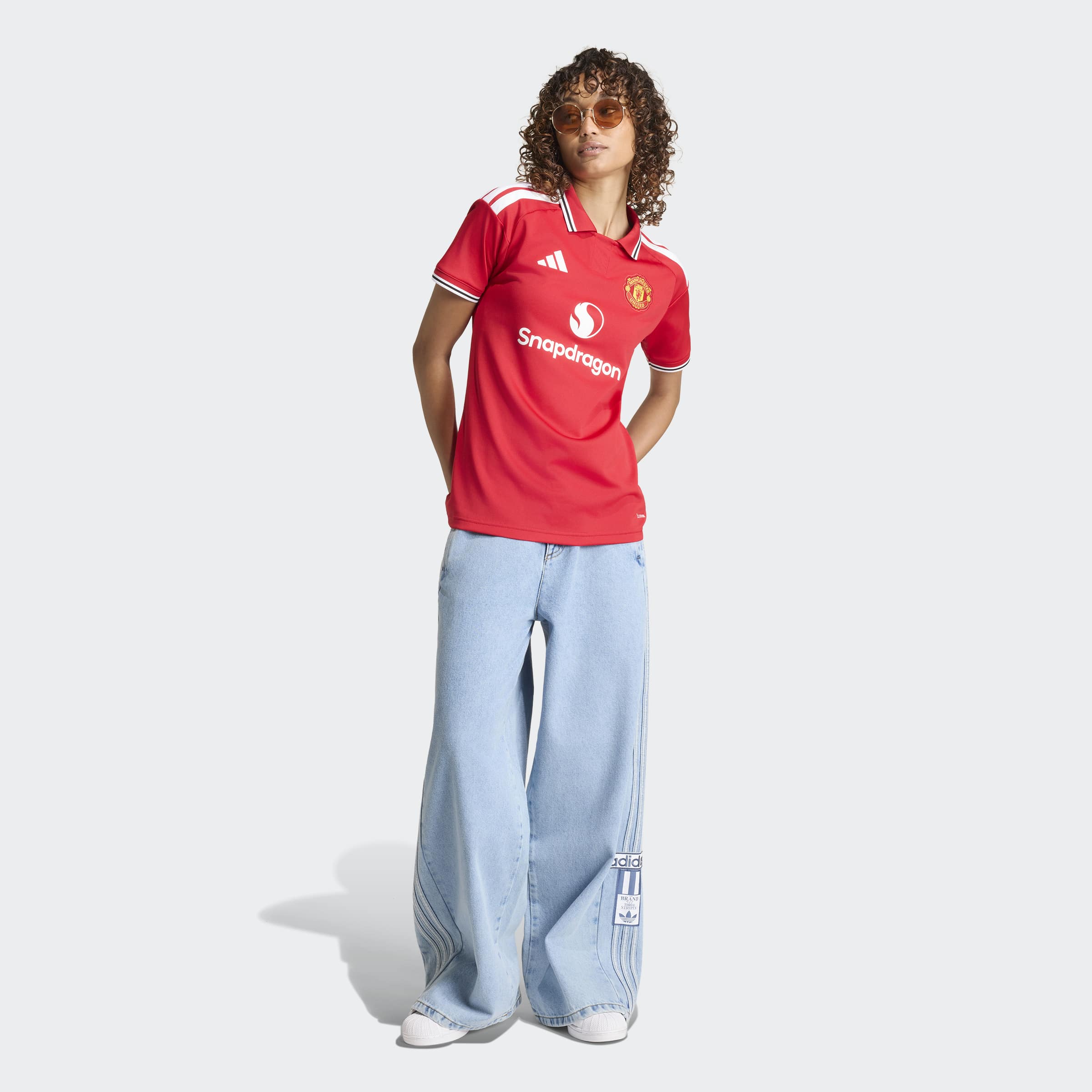 manchester united 2026/27 home shirt, red and white, front view on model