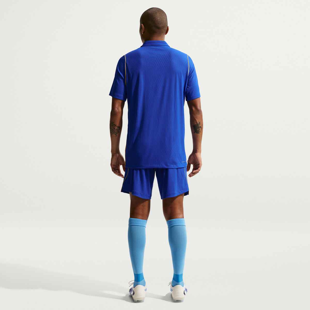 Person wearing a blue sports outfit on a white background