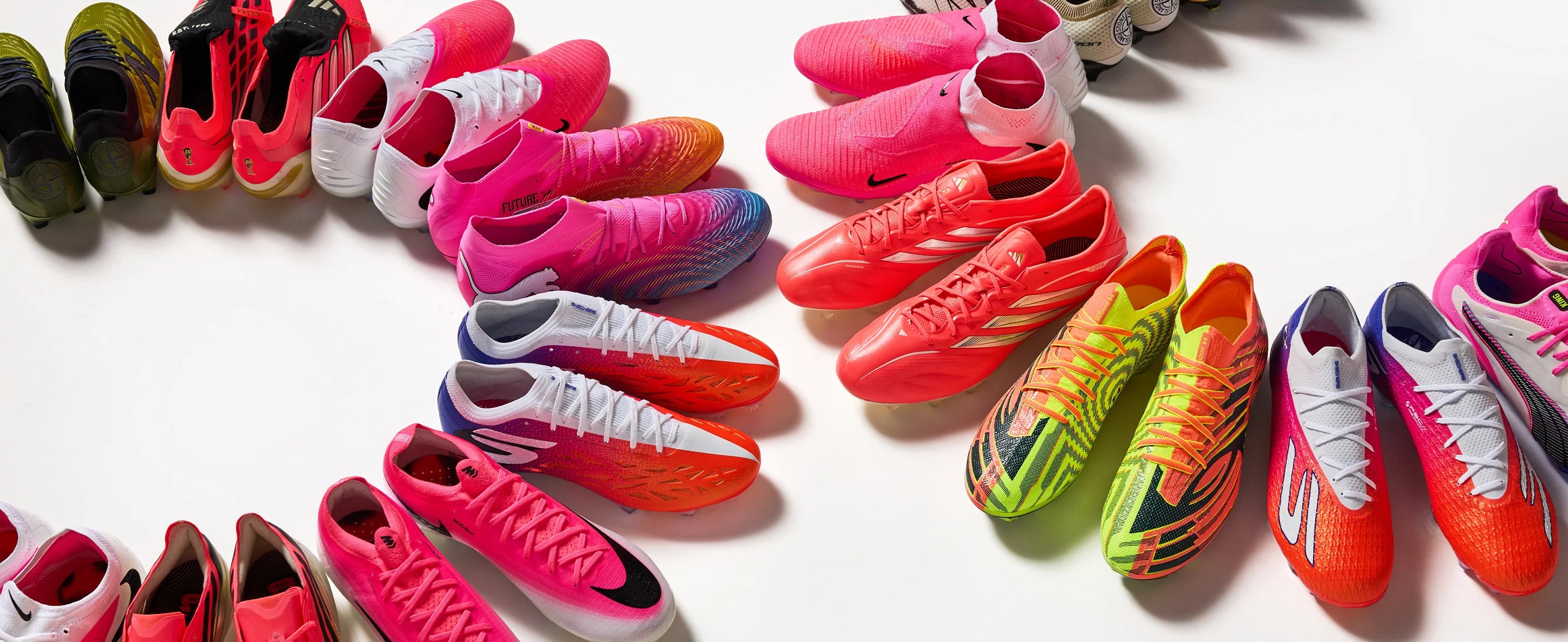 Colorful soccer shoes arranged in a circular pattern on a white background