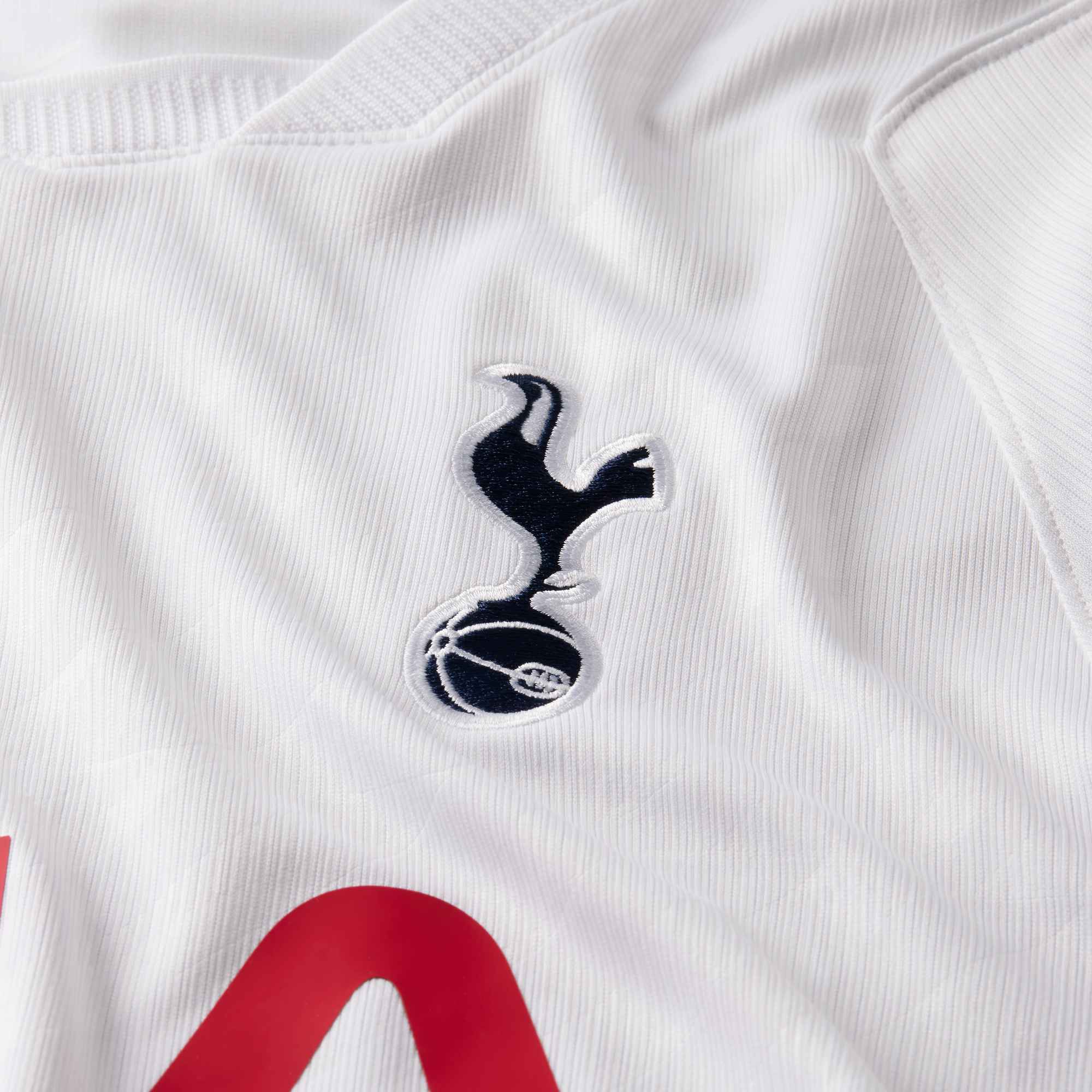 Close-up of a sports jersey with a logo on a white background